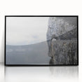 Framed acrylic wall art featuring a stunning landscape design with intricate rock formations, presented in a sleek black frame, ideal for modern home decor.