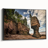 Framed canvas wall art showcasing a modern landscape design with prominent rock formations, featuring a sleek black frame and side profile view, ideal for contemporary decor.
