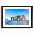 Framed wall art featuring a stunning landscape design with rocky formations, presented in a sleek black frame with a mat, ideal for modern home decor.