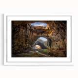Framed wall art collection showcasing a striking landscape design featuring rocks, presented in a sleek white frame with a mat. Ideal for modern decor.
