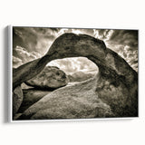 Framed canvas wall art showcasing a serene landscape with rocks and natural elements, accented by a white frame, perfect for home decor and interior design inspiration.