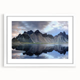Framed landscape wall art featuring a serene rocky scenery in neutral tones, set in a white mat and frame, perfect for home decor and aesthetic enhancement.