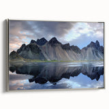 Framed canvas wall art featuring a serene landscape of rugged rocks and natural textures, set in a sleek silver frame, ideal for modern home decor.