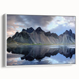 Framed canvas wall art showcasing a serene landscape with rocks and greenery, accented by a white frame, perfect for enhancing home decor aesthetics.