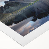 Rolled canvas wall art showcasing a vibrant landscape with intricate rock formations, designed to enhance home decor, packaged securely in a protective tube.