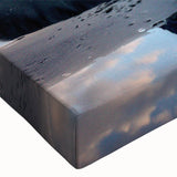 Close-up of a textured stretched canvas featuring a vibrant landscape design with rocks and earthy tones, ideal for modern home decor and artistic ambiance.