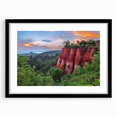 Framed wall art display featuring a serene landscape design with rocky formations and soft colors, set in a sleek black frame, ideal for modern home decor.