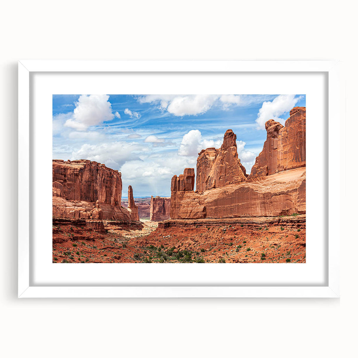 Framed wall art collection showcasing a serene landscape with striking rocks and vibrant colors, set in a white mat and frame, perfect for modern decor.