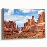 Framed canvas wall art showcasing a stunning landscape design featuring rocky formations and golden tones, elegantly displayed from a side view to highlight its depth and texture.