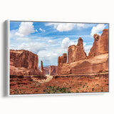 Framed canvas wall art featuring a serene landscape with rocks, displayed against a white background. Ideal for modern home decor, adding tranquility and elegance.