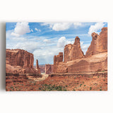 Stretched canvas wall art showcasing a vibrant landscape of rocky formations, featuring earthy tones and intricate details, perfect for home décor enhancement.