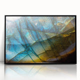 Framed acrylic wall art showcasing a modern landscape design with textured rocks, featuring a sleek black frame, perfect for contemporary decor.