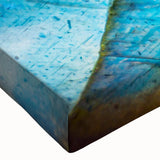 Close-up of a stretched canvas featuring a vibrant landscape design with textured rocks, perfect for home decor, adding depth and natural beauty to any space.