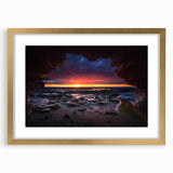 Framed landscape wall art featuring a serene rock design, elegantly matted and showcased in a gold frame, perfect for enhancing modern home decor.
