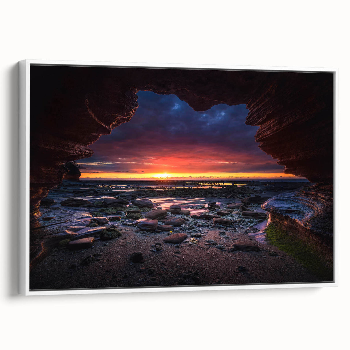 Framed canvas artwork showcasing a serene landscape with textured rocks and soft hues, elegantly displayed in a white frame, perfect for modern home decor.