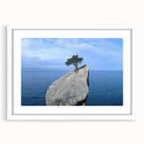 Framed wall art featuring a stunning landscape design with rocks and natural elements, presented in a sleek white mat and frame, ideal for enhancing home decor.