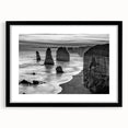 Framed wall art collection showcasing a serene seascape design, featuring calming blue and white hues, with a sleek black frame and mat, perfect for coastal decor.
