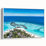 Framed canvas wall art showcasing a serene seascape design with soft blue and white hues, elegantly displayed with a white frame, perfect for coastal decor.