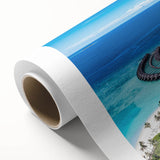 Rolled canvas artwork showcasing a vibrant seascape design with rich blues and greens, highlighting waves and coastal scenery, ideal for home decor.