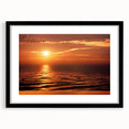 Framed black wall art featuring a modern seascape design, showcasing tranquil blue and white ocean waves, ideal for home decor and enhancing interior aesthetics.