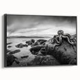 Framed canvas wall art featuring a serene seascape design in vibrant blues and greens, showcasing gentle waves and a tranquil atmosphere. The artwork has a sleek black frame, adding a modern touch suitable for home decor.