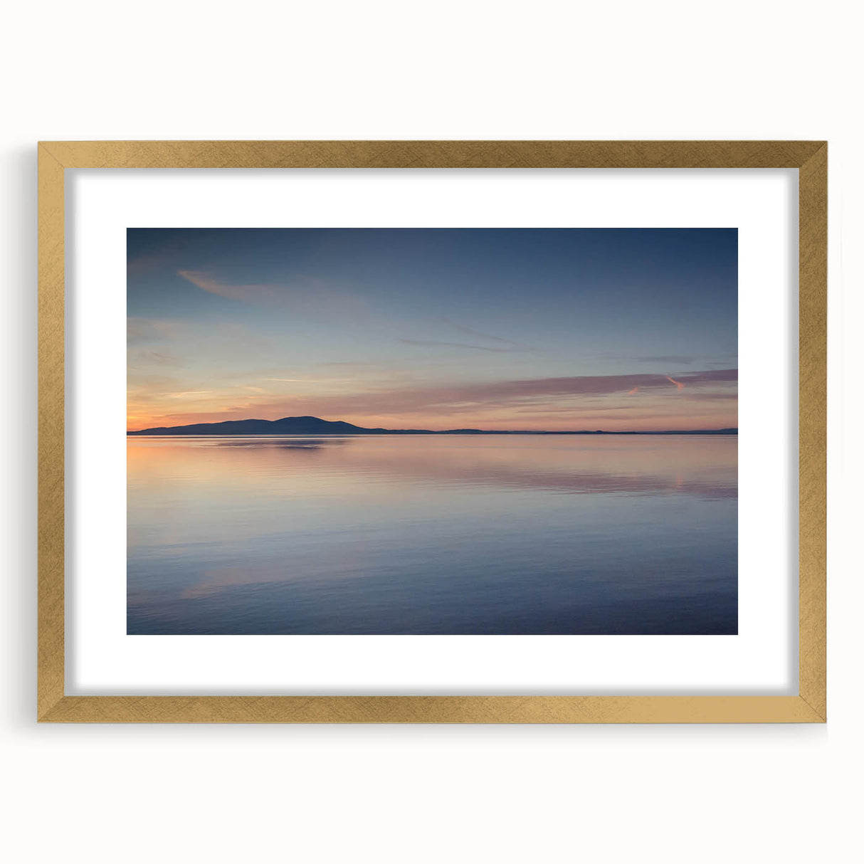 Elegant gold-framed wall art featuring a serene seascape, showcasing soft blues and warm sandy tones, ideal for enhancing home decor in coastal-themed interiors.