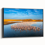 Framed canvas wall art showcasing a serene seascape design, featuring calming blues and greens, displayed from the side against a neutral backdrop.