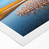 Rolled canvas artwork showcasing a stunning seascape design with vibrant blues and greens, perfect for home decor. Packaged in a protective cardboard tube for safe delivery.