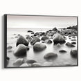 Framed canvas wall art showcasing a serene seascape design with vibrant blues and greens, presented in a sleek black frame, perfect for modern decor.