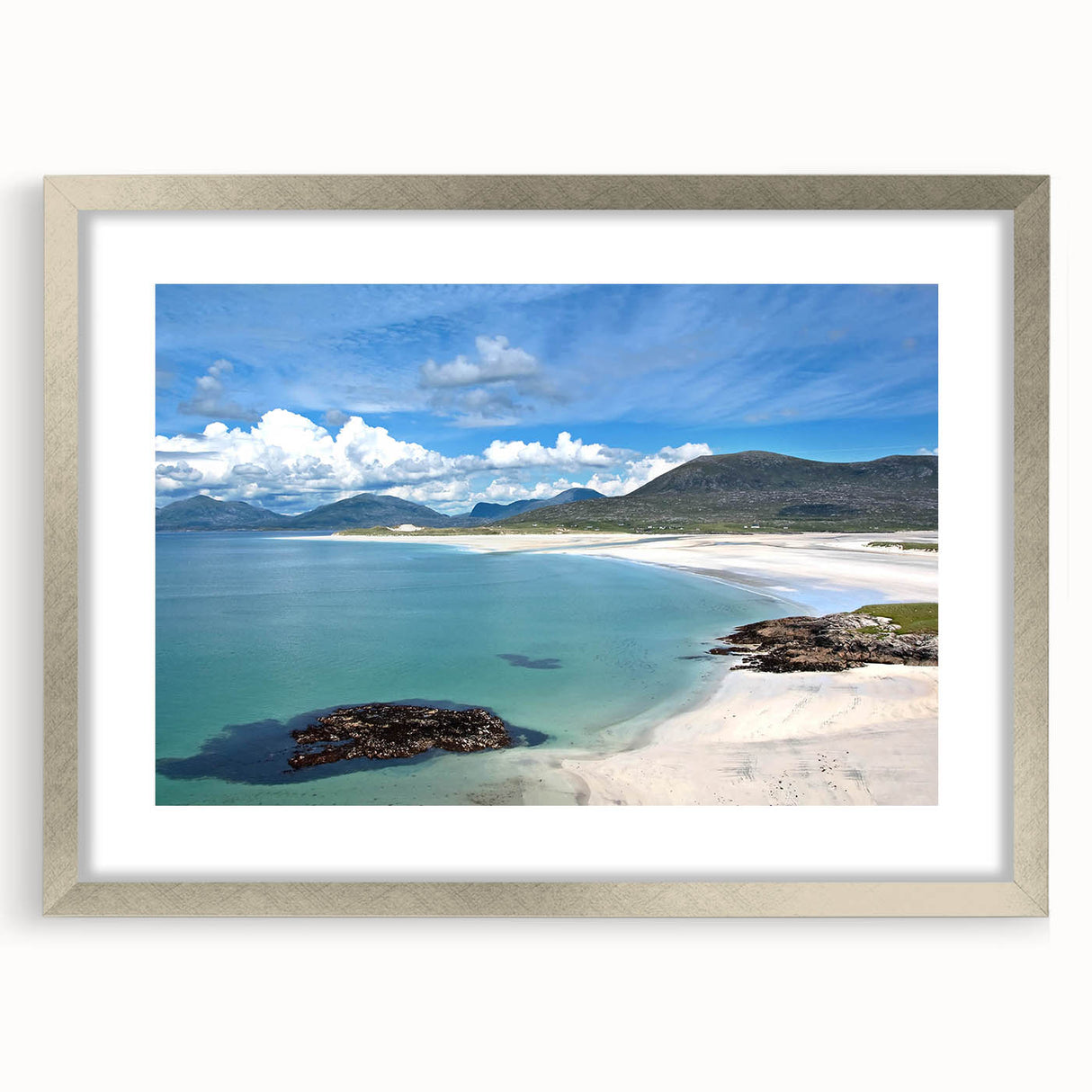 Framed landscape and seascape wall art collection showcasing serene ocean and mountain views, elegantly bordered with a silver mat, perfect for home decor.