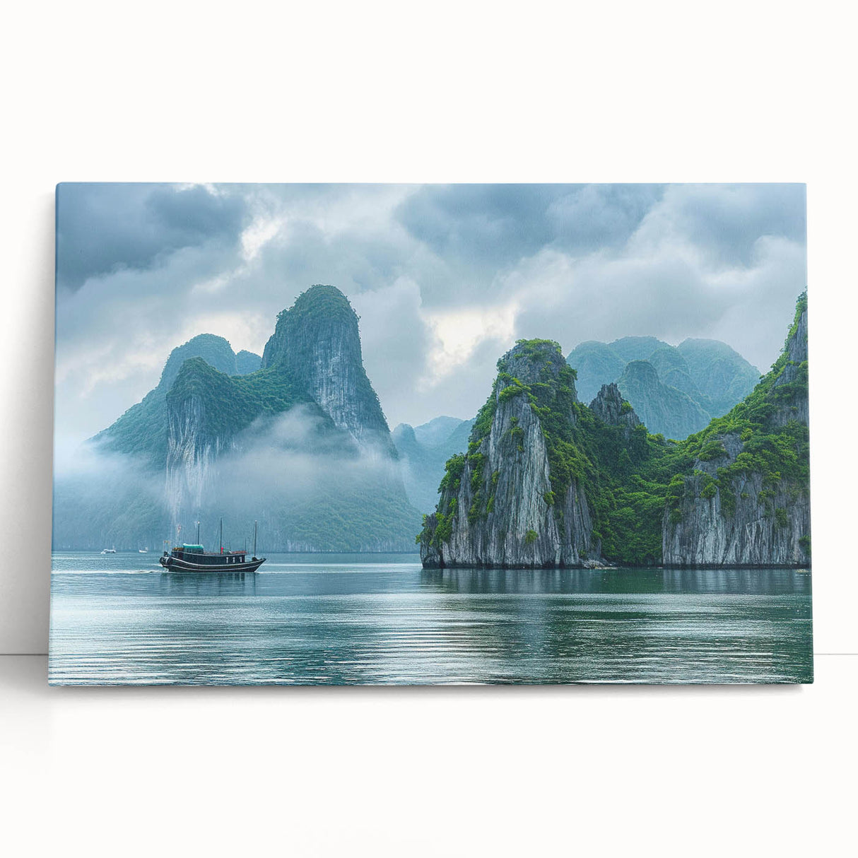 Stretched canvas artwork featuring a serene seascape design with soft blue and green hues, elegantly leaning against a neutral wall, perfect for coastal decor.