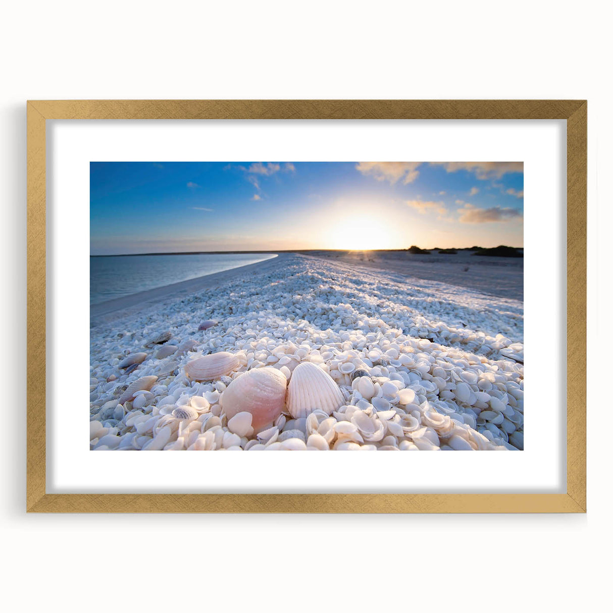 Framed wall art collection featuring a serene seascape design with gold matting, elegantly displayed in a contemporary frame, ideal for enhancing home decor.