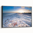 Framed canvas wall art showcasing a serene seascape design with calming blue tones and a black frame, ideal for enhancing modern home decor. Perfect for coastal-themed interiors.