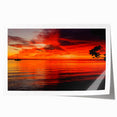 Vibrant seascape wall art print showcasing a serene sunset over calm waters, featuring rich blues and warm oranges, rolled and ready for framing.