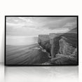 Framed wall art featuring a vibrant seascape design with rich blue and green hues, elegantly displayed in a sleek black frame to enhance any decor.