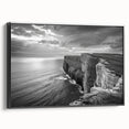 Framed canvas wall art showcasing a serene seascape design with soft blue and green hues, elegantly displayed with a black frame, perfect for coastal home decor.