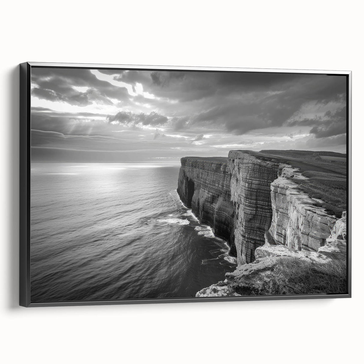 Framed canvas wall art showcasing a serene seascape design with soft blue and green hues, elegantly displayed with a black frame, perfect for coastal home decor.