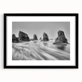 Framed wall art featuring a serene seascape design in a black frame with a white mat, showcasing calming ocean waves and a clear blue sky, perfect for home decor.