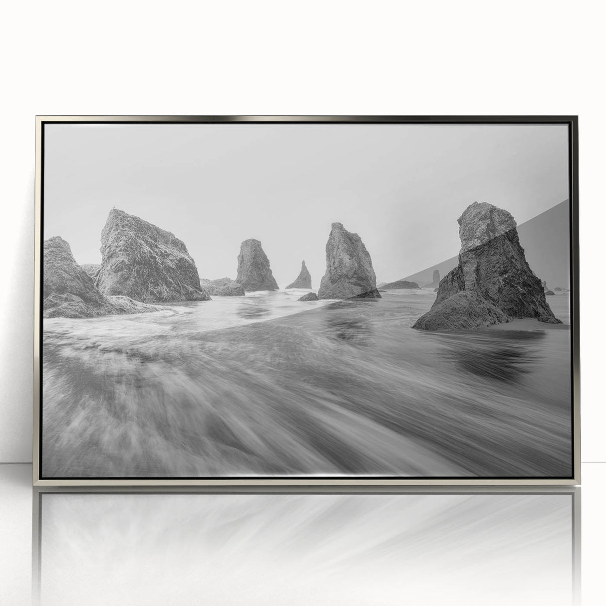 Framed wall art from the Landscapes & Seascapes collection, showcasing a tranquil ocean view with silver accents, ideal for modern home decor.