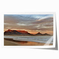 Vibrant rolled print of seascape wall art showcasing serene ocean waves and a colorful sunset, ideal for home decor, packaged securely in a cardboard tube.