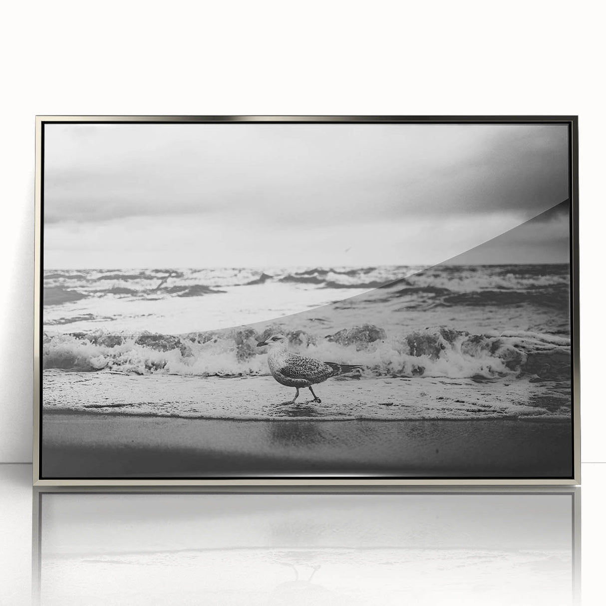 Framed acrylic wall art collection featuring a serene seascape design with silver accents, ideal for enhancing modern home decor. The artwork showcases calming ocean waves and a tranquil horizon, perfect for adding a touch of elegance to any living space.