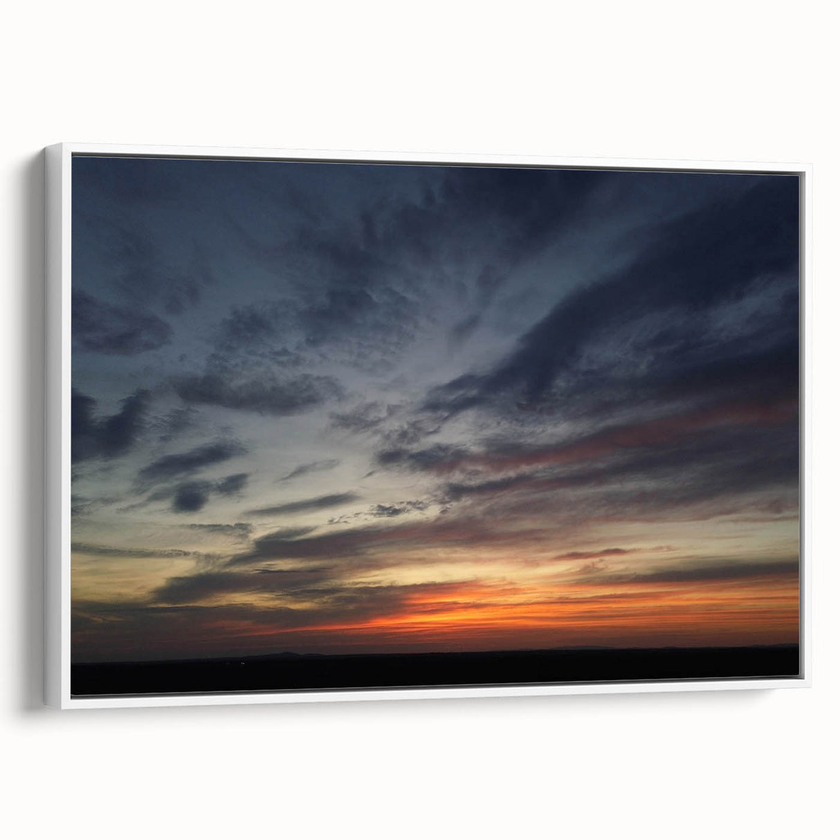 Framed canvas wall art showcasing a vibrant landscape design with a rich color palette, viewed from the side against a neutral backdrop, perfect for enhancing modern decor.