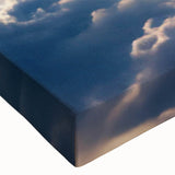 Close-up of a stretched canvas wall art piece showcasing a vibrant landscape and skyscape design, featuring rich colors and intricate details, perfect for home decor.