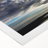 Rolled canvas artwork showcasing a vibrant landscape with dramatic skies, featuring rich colors and textures, perfect for home decor or office settings.