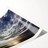 Vibrant rolled print from the Landscapes and Skyscapes wall art collection, showcasing a stunning sunset over mountains, perfect for home decor enhancement.