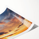 Vibrant rolled print of a stunning landscape featuring a dramatic sunset over rolling hills, designed as part of a contemporary wall art collection, ideal for home decor.
