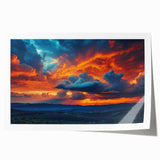 Rolled landscape wall art print featuring a vibrant sunset over a serene lake, showcasing rich colors of orange, pink, and blue, perfect for home decor.
