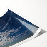 Vibrant rolled print of a serene landscape featuring a dramatic sky, perfect for home decoration. Ideal for art enthusiasts seeking nature-inspired wall art.