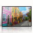 Framed acrylic wall art depicting a vibrant urban landscape with streets and buildings, featuring a modern design in a sleek black frame, ideal for home decor.