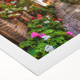 Rolled canvas showcasing a vibrant street landscape design with colorful buildings and intricate details, perfect for modern home decor. Packaged securely in a cardboard tube for safe delivery.